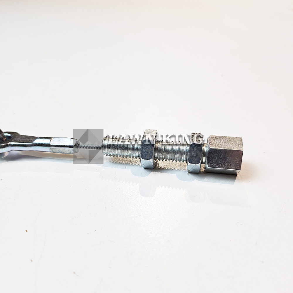 Close up of the screw bolt end of the blade clutch cable for Stiga Group range of garden tractors. This part is set flat against a white background.